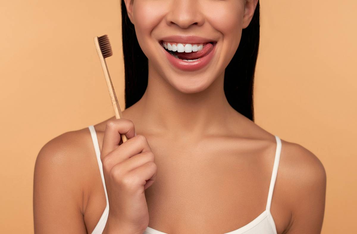 concept of woman going to brush dental veneers
